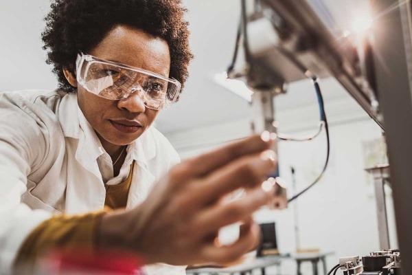 Researcher holding a piece of lab equipment